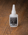 Bottle of BOSSDOG on a wooden surface