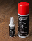 Two bottles of BossDog Glue Company activator on a wooden surface